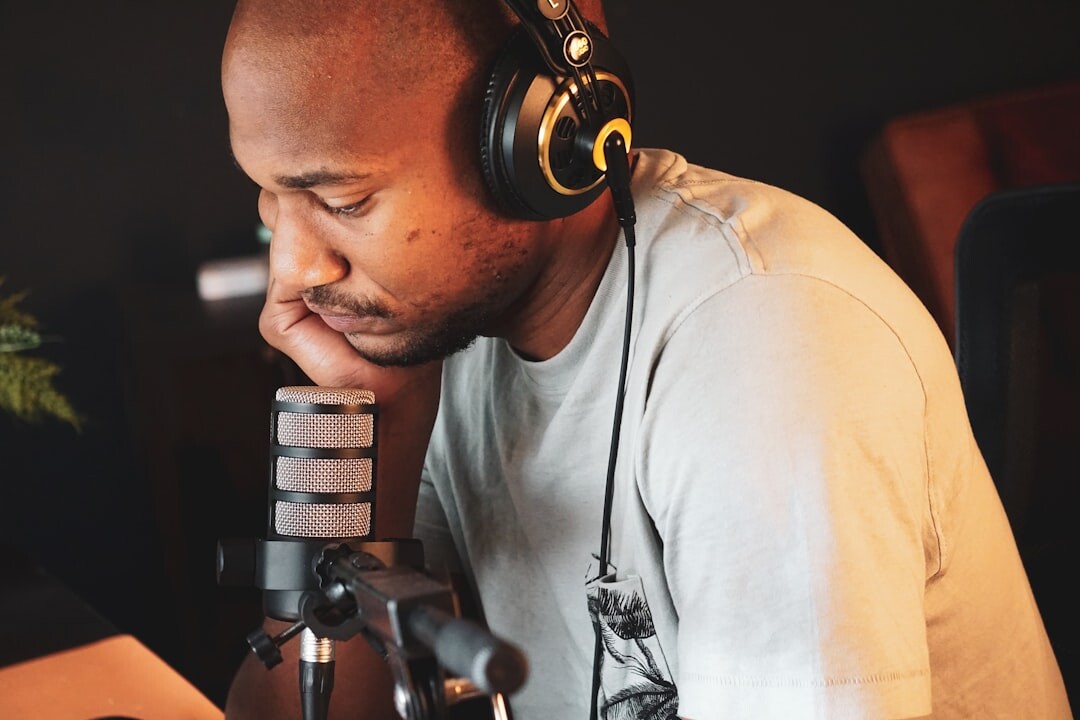 Radio presenter speaking into a microphone during a live broadcast